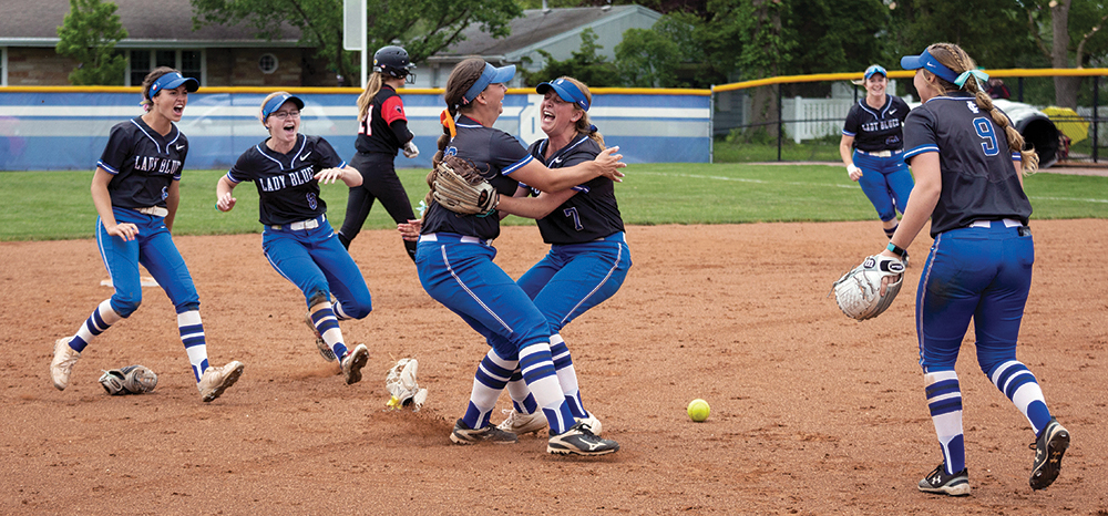 Softball team celebrating