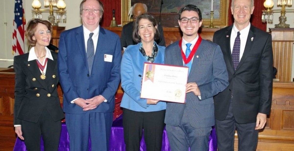 Christian Flores at Awards ceremony with Gov. Rauner