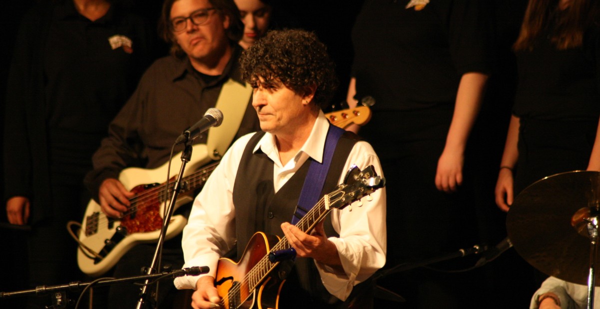 Photo of Chris Vallillo playing guitar