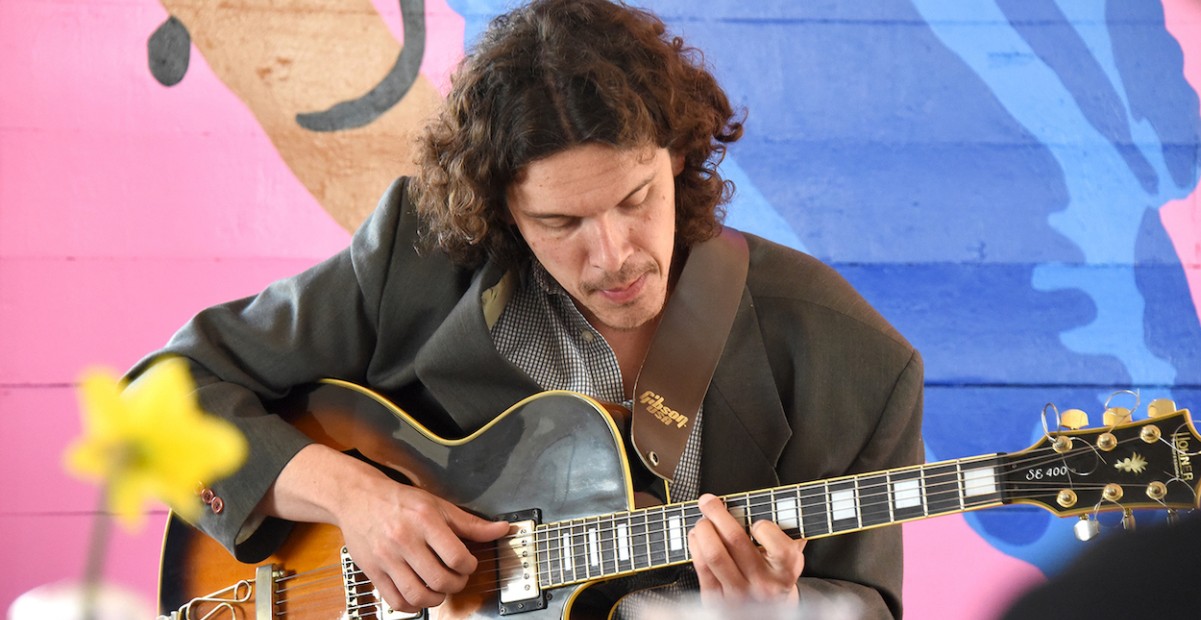 Jose Gobbo playing guitar