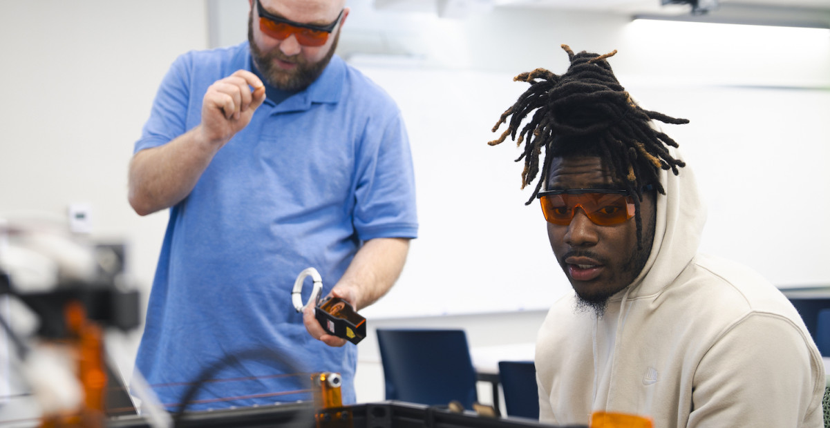Mechanical engineering student and professor working on project