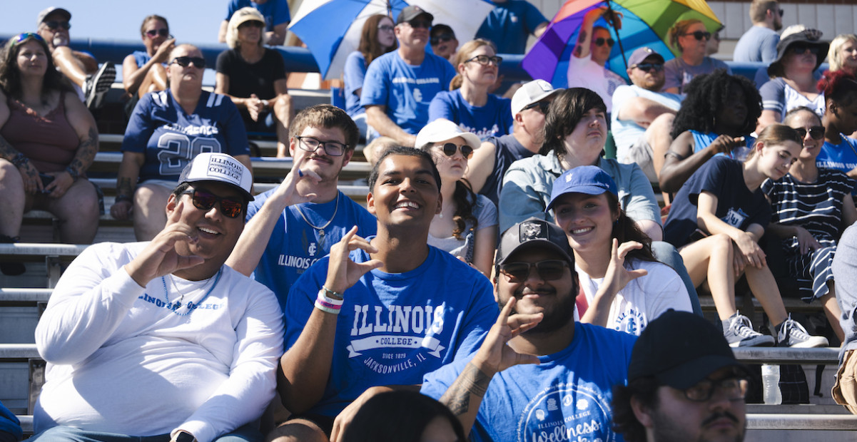 Students in the bleachers at homecoming
