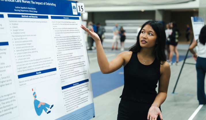 Student presenting poster at Celebration of Excellence