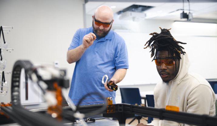 Mechanical engineering student and professor working on project
