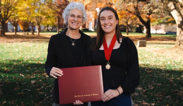 President Barbara A. Farley (left) and Shannon Engmann '24 (right) with Shannon's award on the Quad