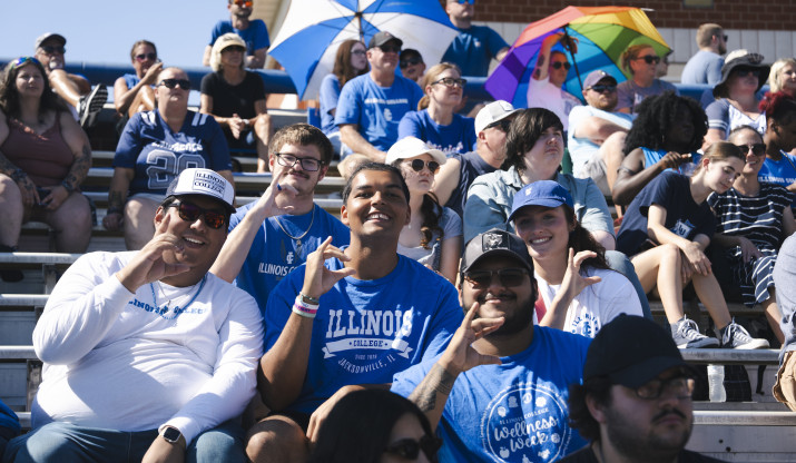 Students in the bleachers at homecoming