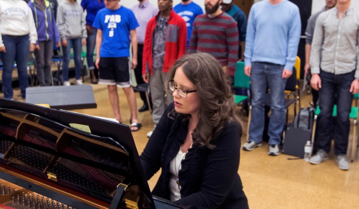 musgrove on piano leading choir